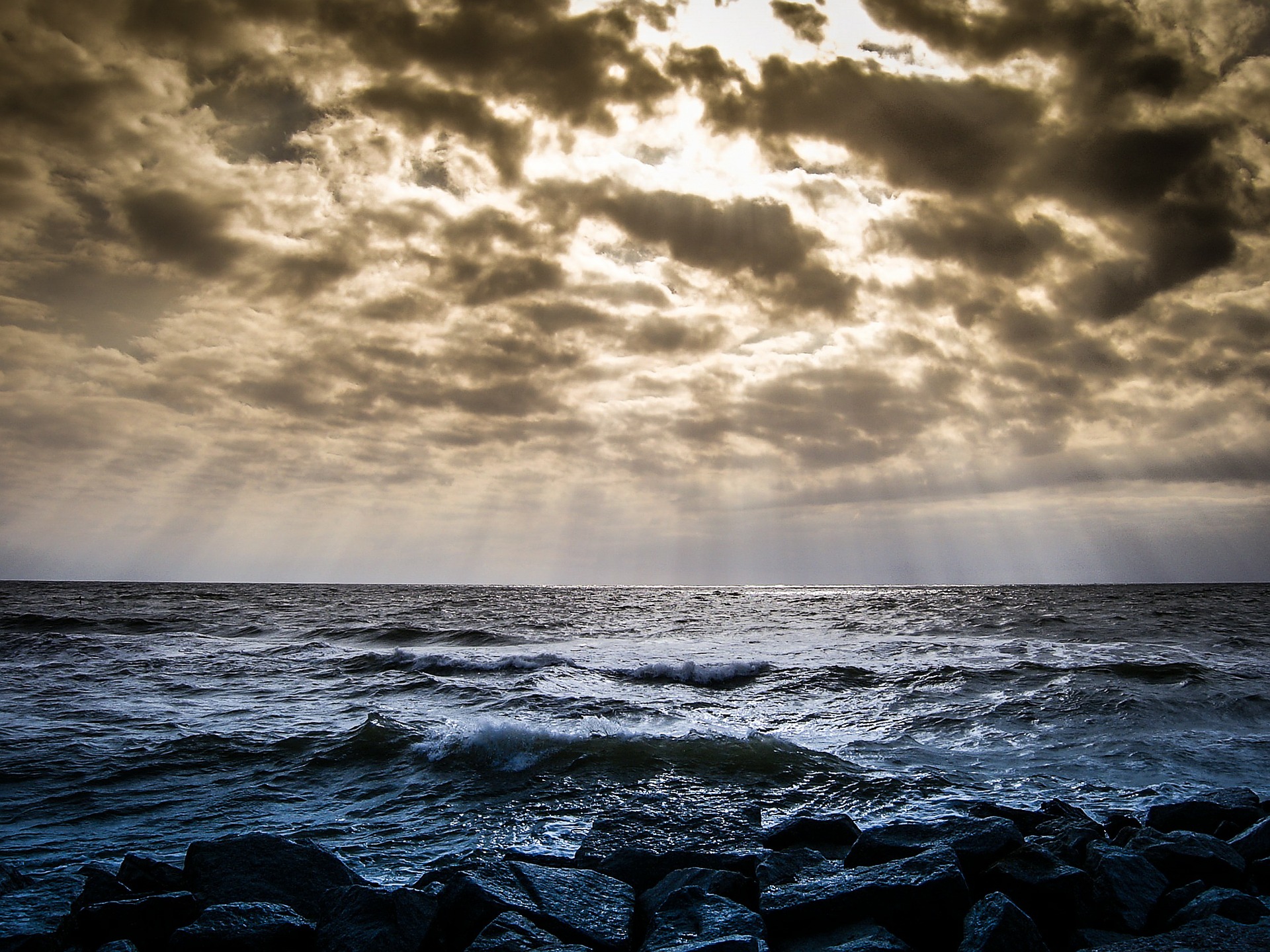 Clouds over the sea with light breaking through
